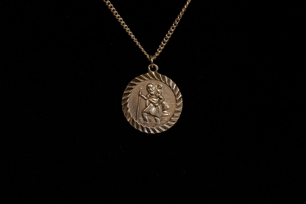 Round Sterling Silver St Christopher pendant on chain.