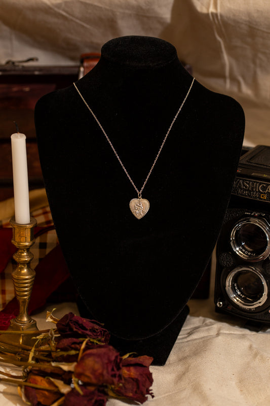 Heart Shaped sterling silver Saint Christopher necklace.