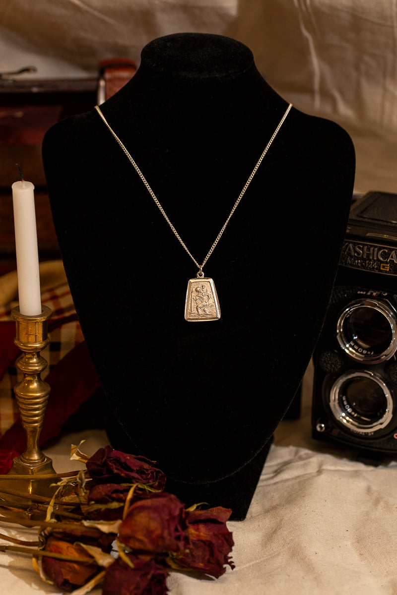 Rectangular sterling silver Saint Christopher necklace.