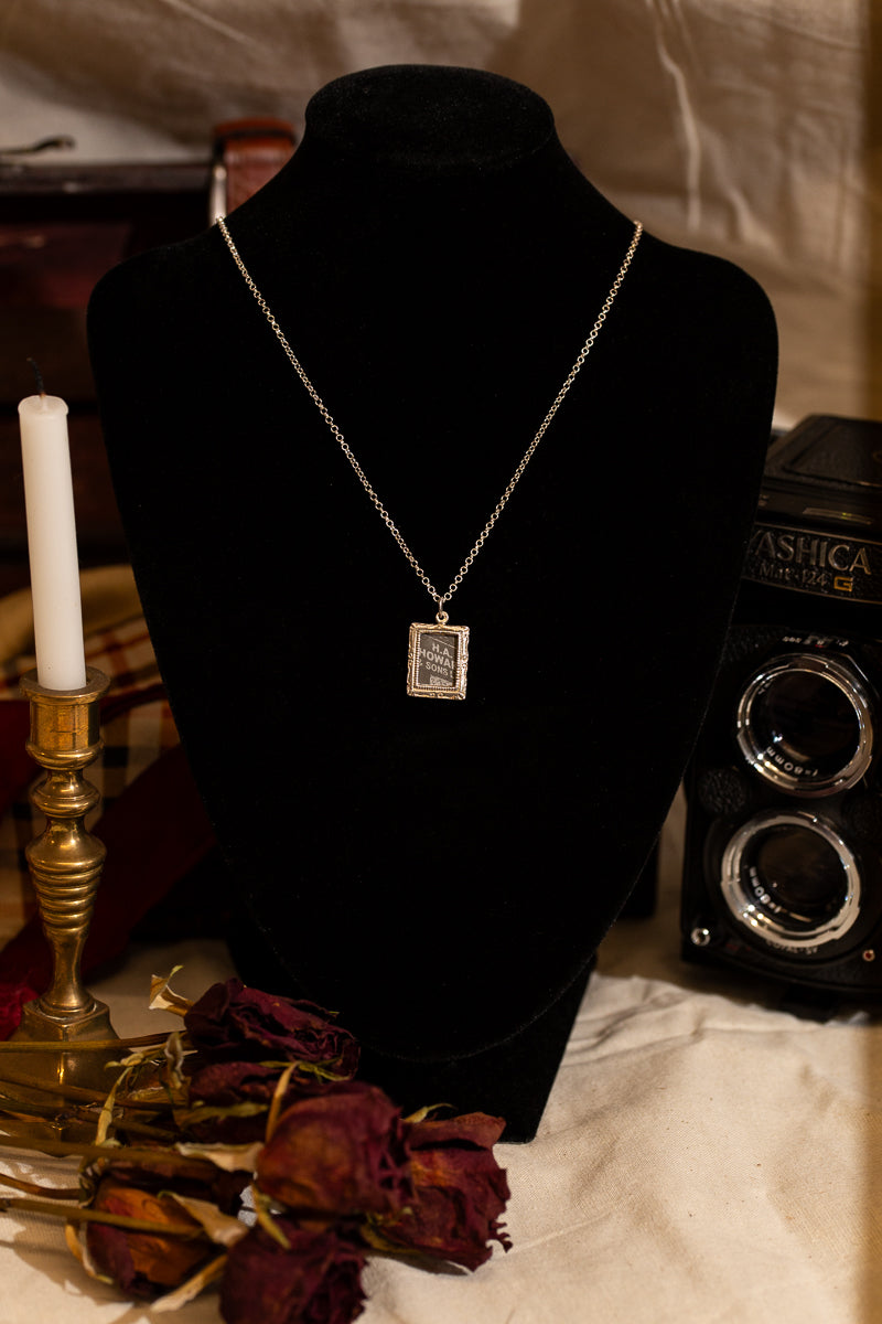 Sterling Silver photo frame necklace containing a picture of Manchester shot on film.