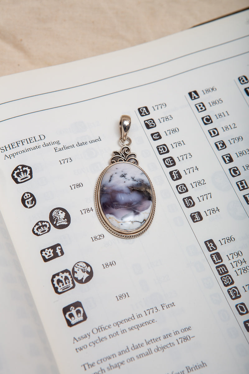 Beautiful Dendritic Opal Pendant with gorgeous inclusions in a sterling silver setting.