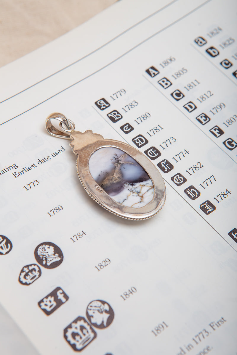 Beautiful Dendritic Opal Pendant with gorgeous inclusions in a sterling silver setting.