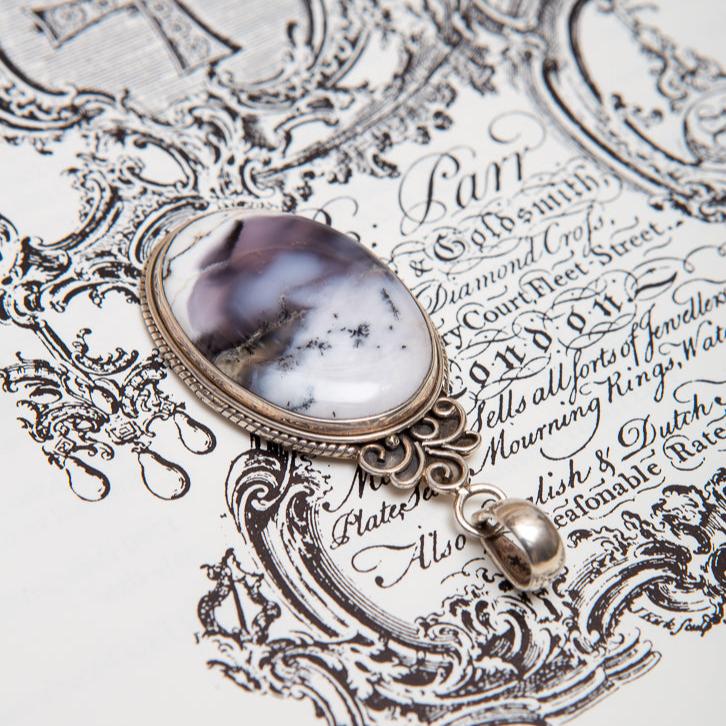 Beautiful Dendritic Opal Pendant with gorgeous inclusions in a sterling silver setting.