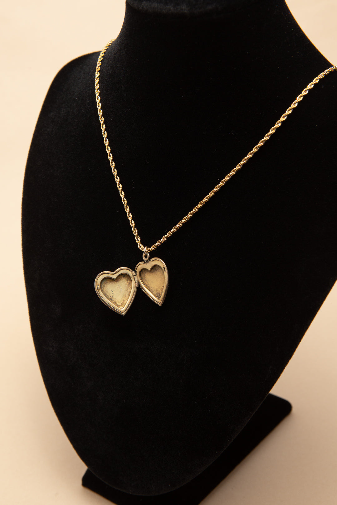 Rolled gold heart shaped locket on a rope chain