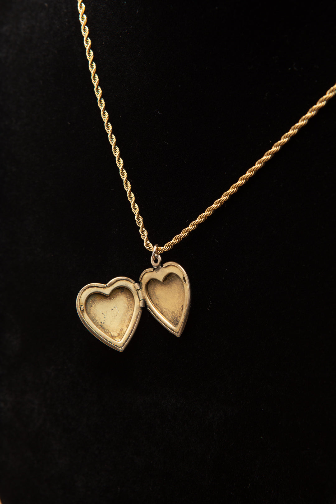 Rolled gold heart shaped locket on a rope chain